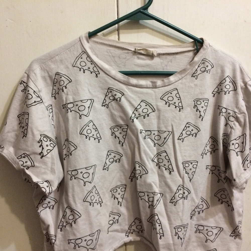 Im selling a crop top with pizza symbols on it.